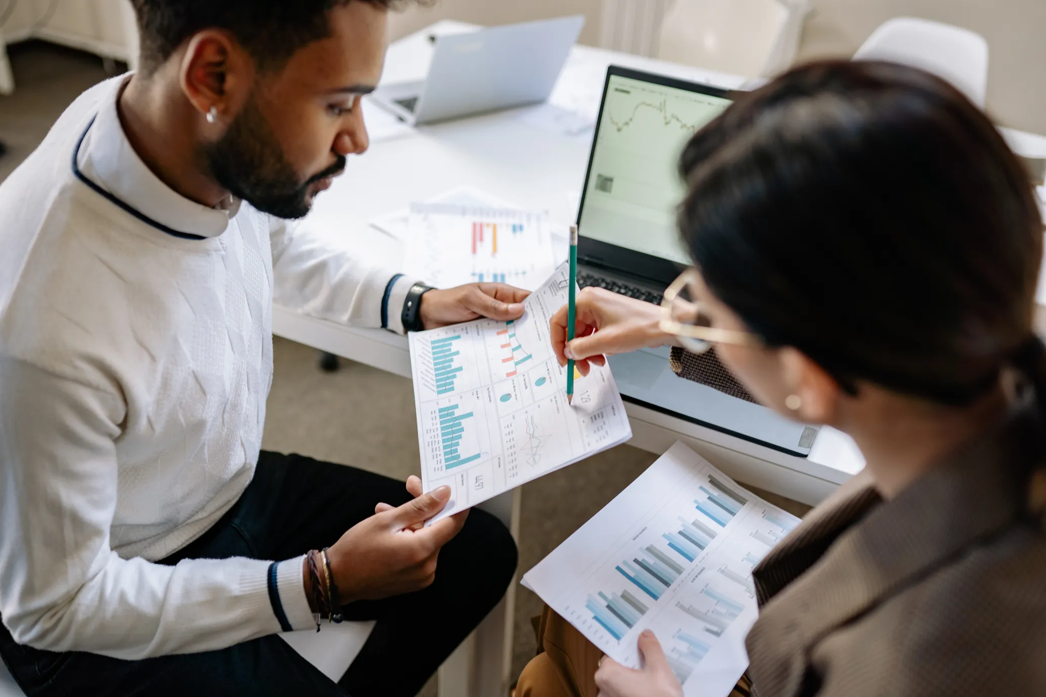 Man and woman sharing statistics result